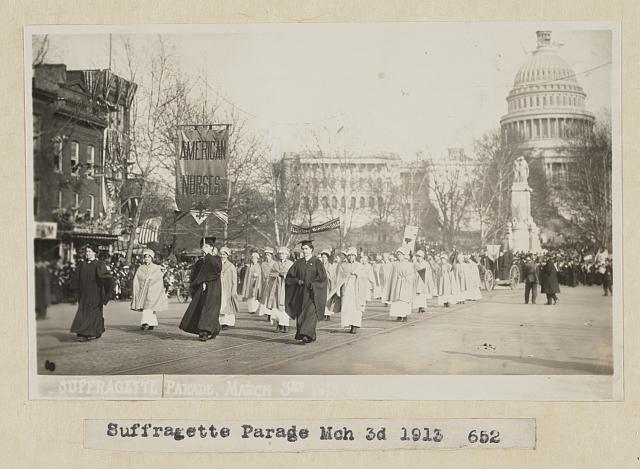 Nurses marching in 1913 women's suffrage parade in Washington, DC, with U.S. Capitol dome in the background.